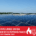 Impianto fotovoltaico su tetto industriale con banner rosso che annuncia le nuove linee guida antincendio dal 1 settembre 2025